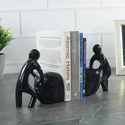 Man Pushing Stone Bookends - set of 2